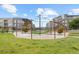 Expansive community green space featuring pedestrian walkways, shade structures, and lush landscaping for residents at 524 E Hinsdale Ave, Littleton, CO 80122