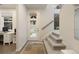 Bright entryway with staircase, modern door with glass panels, and office space at 524 E Hinsdale Ave, Littleton, CO 80122