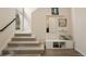 Bright entryway with a staircase, storage bench, and stylish decor at 524 E Hinsdale Ave, Littleton, CO 80122