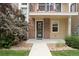 Inviting front entrance with a decorative wreath and manicured landscaping at 524 E Hinsdale Ave, Littleton, CO 80122
