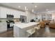 Bright kitchen boasts a quartz island, stainless steel appliances, and an open concept design at 524 E Hinsdale Ave, Littleton, CO 80122
