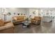 Cozy living room with leather seating, glass coffee table, and modern lighting at 524 E Hinsdale Ave, Littleton, CO 80122
