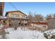 Spacious backyard features patio, pergola, mature trees, and a rock garden that enhance the landscape appeal at 454 S Eaton St, Lakewood, CO 80226