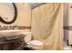 Charming bathroom features custom sink, toilet, and tiled walls at 454 S Eaton St, Lakewood, CO 80226