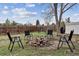 Backyard with a fire pit and seating is perfect for entertaining guests outdoors at 714 S Tabor St, Elizabeth, CO 80107