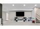 Spacious finished basement with carpet floors and toy storage at 502 Green Mountain Dr, Erie, CO 80516
