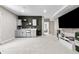 Finished basement with wet bar and mini-fridge, carpet floors and entertainment center at 502 Green Mountain Dr, Erie, CO 80516