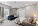 Finished basement bedroom with queen bed, futon, plush carpet, and ample closet space at 502 Green Mountain Dr, Erie, CO 80516