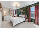 Stylish bedroom with floral wallpaper and plush furnishings at 502 Green Mountain Dr, Erie, CO 80516