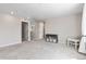 Large bonus room with neutral walls and carpet, ample natural light, perfect for a playroom or media room at 502 Green Mountain Dr, Erie, CO 80516