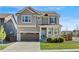 Charming two-story home with a well-manicured lawn and a two-car garage, perfect for Gathering living at 502 Green Mountain Dr, Erie, CO 80516