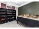 This game room features miniature figures on shelves and a tabletop with an oval light fixture at 502 Green Mountain Dr, Erie, CO 80516