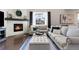 Cozy living room featuring a fireplace, plush seating, and warm decor for a comfortable atmosphere at 502 Green Mountain Dr, Erie, CO 80516