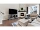 Inviting living room featuring a fireplace, comfortable seating, and stylish decor for relaxation at 502 Green Mountain Dr, Erie, CO 80516