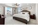 Inviting main bedroom featuring neutral walls, plush carpeting, and a comfortable bed with ample natural light at 502 Green Mountain Dr, Erie, CO 80516