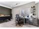 Bright office featuring a large desk, computer setup, a rolling storage and a window view at 502 Green Mountain Dr, Erie, CO 80516