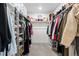 Well-organized walk-in closet with shelving and hanging rods, providing ample storage space for clothing and accessories at 502 Green Mountain Dr, Erie, CO 80516