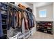 Spacious walk-in closet with custom shelving, hanging racks, and shoe storage, offering ample storage solutions at 502 Green Mountain Dr, Erie, CO 80516