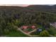 Expansive aerial view of the property showcasing the homes and surrounding forest landscape at 245 N County Highway 67, Sedalia, CO 80135