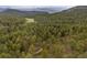 A scenic aerial landscape view of lush forests with mountain views at 245 N County Highway 67, Sedalia, CO 80135