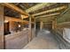 Rustic barn interior with wooden stalls and sawdust floor at 245 N County Highway 67, Sedalia, CO 80135