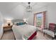 Bright bedroom with vaulted ceiling, natural light, hardwood floors and charming decor at 245 N County Highway 67, Sedalia, CO 80135