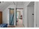 Bedroom features a sliding barn door, vaulted ceiling and neutral color palette at 245 N County Highway 67, Sedalia, CO 80135