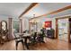 Bright dining room featuring hardwood floors, beamed ceilings, and contemporary décor at 245 N County Highway 67, Sedalia, CO 80135