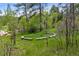 Firepit with seating surrounded by trees and tall grass at 245 N County Highway 67, Sedalia, CO 80135