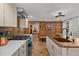 Farmhouse kitchen features soapstone counters, gas range, copper sink and access to the living spaces at 245 N County Highway 67, Sedalia, CO 80135