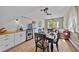 Open-concept living space featuring hardwood floors, modern appliances, and a cozy sitting area at 245 N County Highway 67, Sedalia, CO 80135