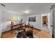 Cozy living room boasts hardwood floors, natural light, rustic furniture and charming decor at 245 N County Highway 67, Sedalia, CO 80135