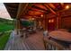 Inviting porch with rustic wood beams, comfortable seating and a table for gatherings at 245 N County Highway 67, Sedalia, CO 80135