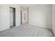 This bedroom has neutral carpet, a sliding door closet, and an open doorway at 10145 Quentin Ct, Commerce City, CO 80022
