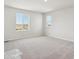 Bright bedroom with large windows, plush carpet, and neutral walls, offering a serene and inviting atmosphere at 10145 Quentin Ct, Commerce City, CO 80022