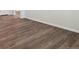 Bedroom featuring hardwood flooring, white walls and baseboards, and lots of natural light at 10145 Quentin Ct, Commerce City, CO 80022