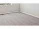 Bedroom with neutral colored carpet, base trim, and a large window at 10145 Quentin Ct, Commerce City, CO 80022
