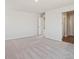 Spacious bedroom with plush carpet, neutral walls, and walk in closet, offering a serene and inviting atmosphere at 10145 Quentin Ct, Commerce City, CO 80022