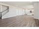 Living room featuring hardwood flooring, neutral paint, recessed lighting, stairs to the second level, and an open layout at 10145 Quentin Ct, Commerce City, CO 80022