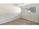 Bright room with laminate flooring, neutral walls, and a window for natural light at 500 Manhattan Dr # B1, Boulder, CO 80303