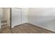 Bedroom featuring laminate floors, neutral walls, closet, and an open door at 500 Manhattan Dr # B1, Boulder, CO 80303