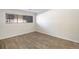 Bright, spacious room with laminate flooring, neutral walls, and a window for natural light at 500 Manhattan Dr # B1, Boulder, CO 80303