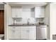 Modern kitchen features stainless steel appliances, white cabinets, and subway tile backsplash at 500 Manhattan Dr # B1, Boulder, CO 80303
