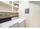 Utility room with washer, dryer, and open shelves for storage at 500 Manhattan Dr # B1, Boulder, CO 80303
