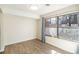 Well-lit room with wood-look floors and a large window with neighborhood views at 500 Manhattan Dr # B1, Boulder, CO 80303