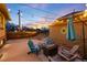 Backyard patio enhanced with a fire pit, decorative lights and a beautiful sunset view at 3044 W 37Th Ave, Denver, CO 80211
