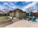 Charming backyard patio featuring a fire pit, seating, and string lights for outdoor entertaining at 3044 W 37Th Ave, Denver, CO 80211