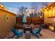 Backyard oasis featuring a fire pit, comfortable seating, and decorative string lights for evening enjoyment at 3044 W 37Th Ave, Denver, CO 80211