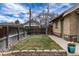 Backyard featuring a grassy area and a fenced perimeter, offering a private outdoor space at 3044 W 37Th Ave, Denver, CO 80211