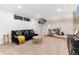 Cozy basement featuring carpeted floors, comfortable seating, and ample lighting for a relaxing living space at 3044 W 37Th Ave, Denver, CO 80211